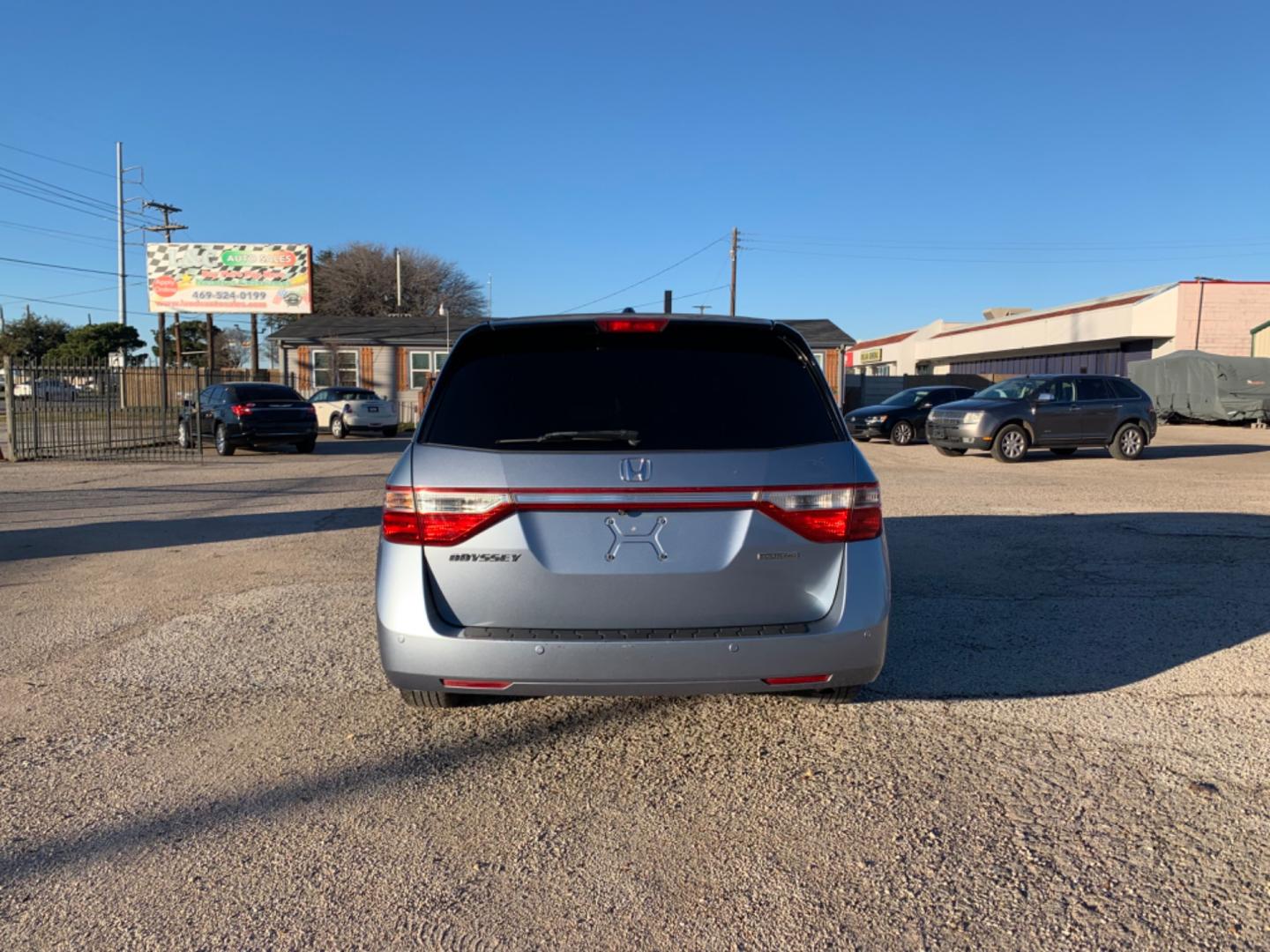 2012 Blue /gray Honda Odyssey Touring (5FNRL5H94CB) with an 3.7L L5 DOHC 20V engine, AUTOMATIC transmission, located at 1830 North Belt Line Road, Irving, TX, 75061, (469) 524-0199, 32.834373, -96.993584 - Photo#4